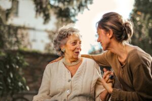 Smiling Caregiver Talking with her client.
